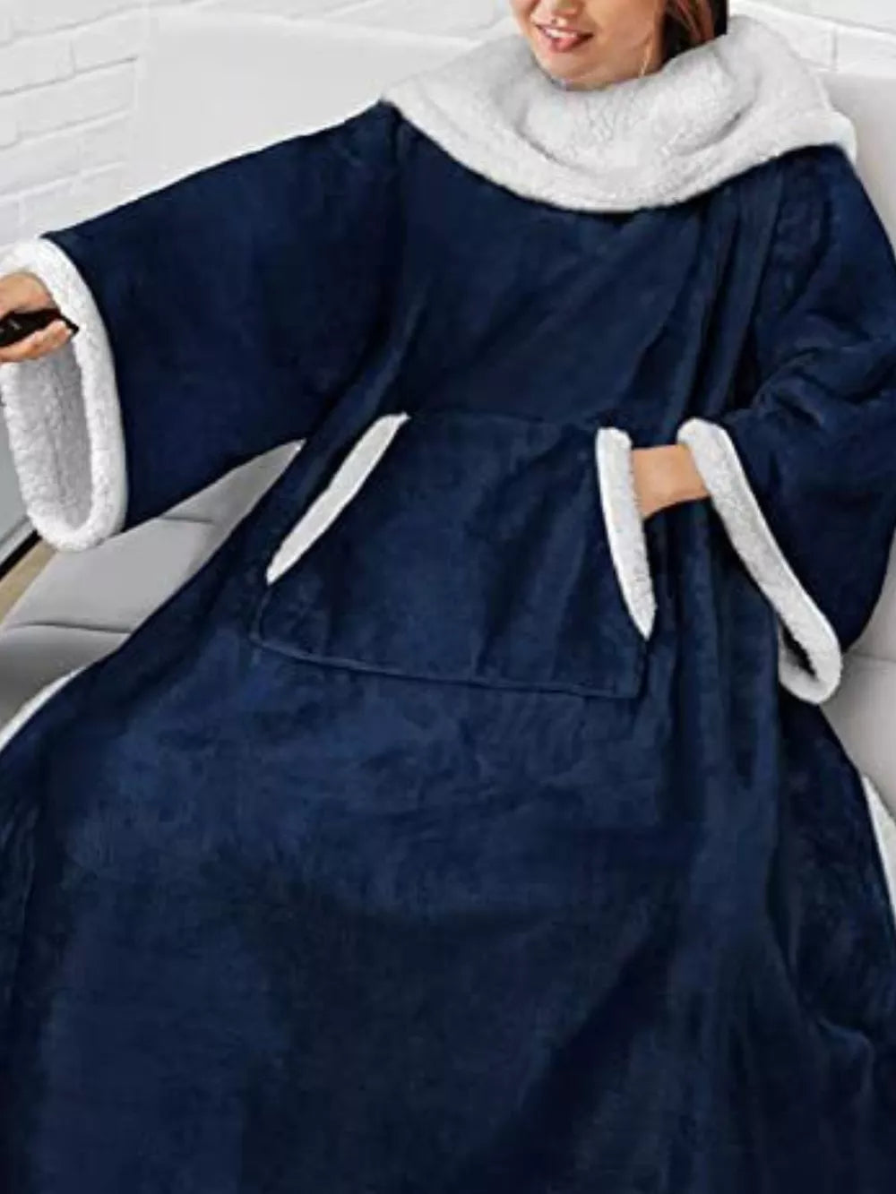 Blue sherpa-trim wearable blanket — pocket and sleeve detail