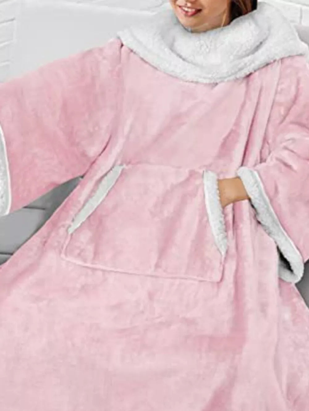 Pink sherpa-trim wearable blanket — pocket and sleeve detail
